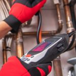 Technician using a gas leak detection tool on plumbing pipes, emphasizing safety in gas line repair services by Southside Plumbing in Omaha, NE.